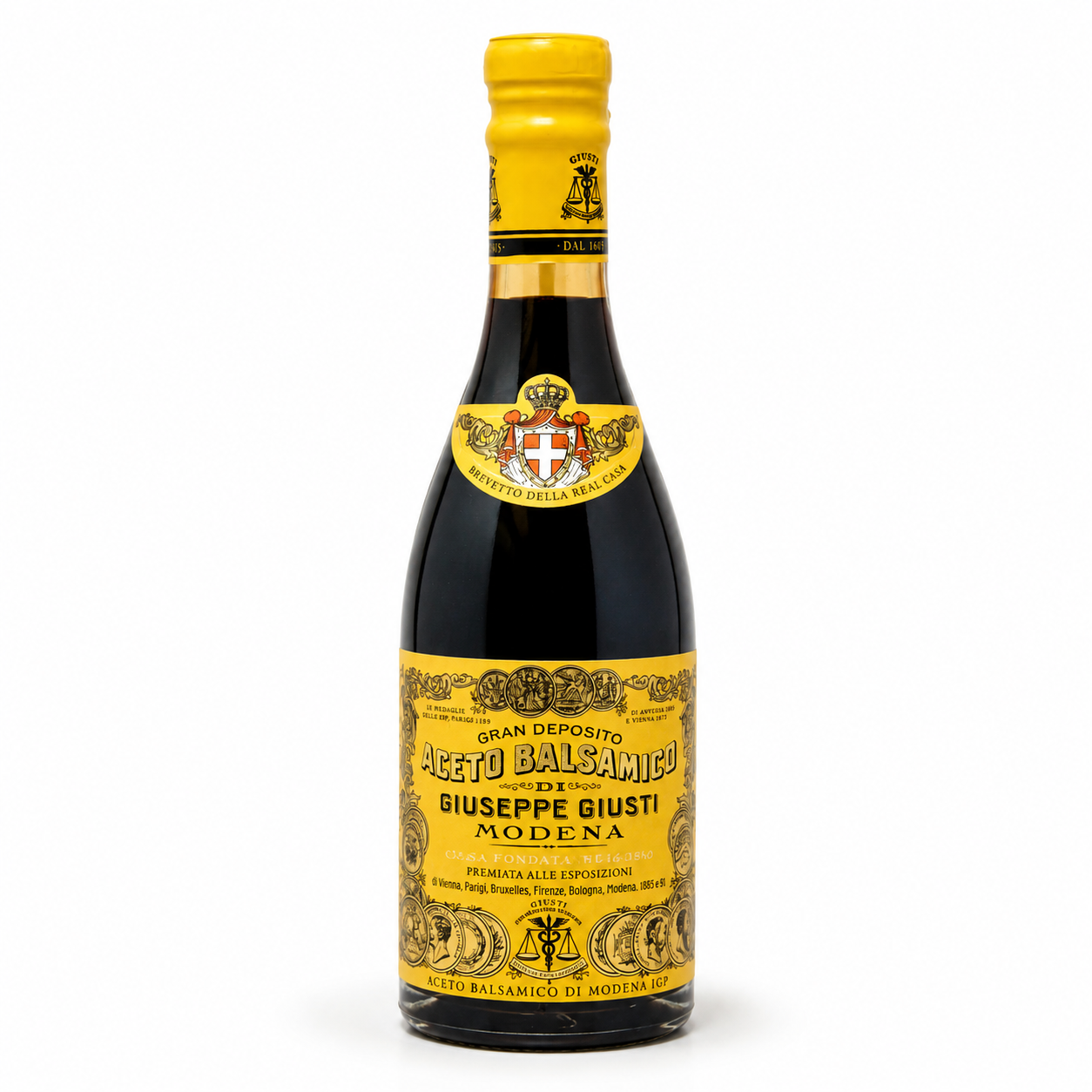 Bottle of Aceto Balsamico with yellow label on a white background
