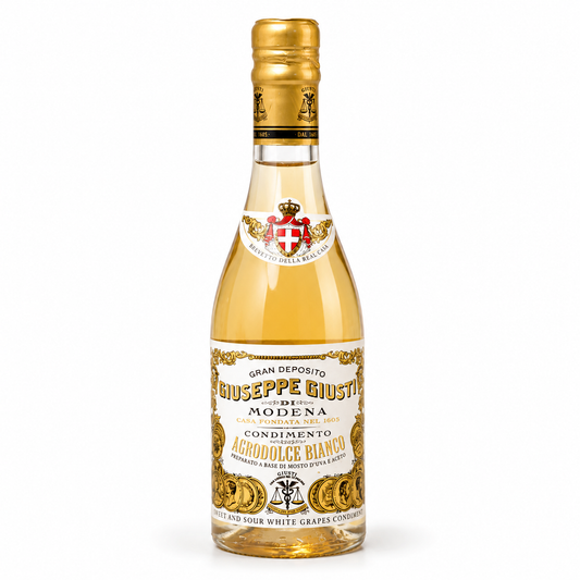 Bottle of Agrodolce Bianco with gold cap on a white background