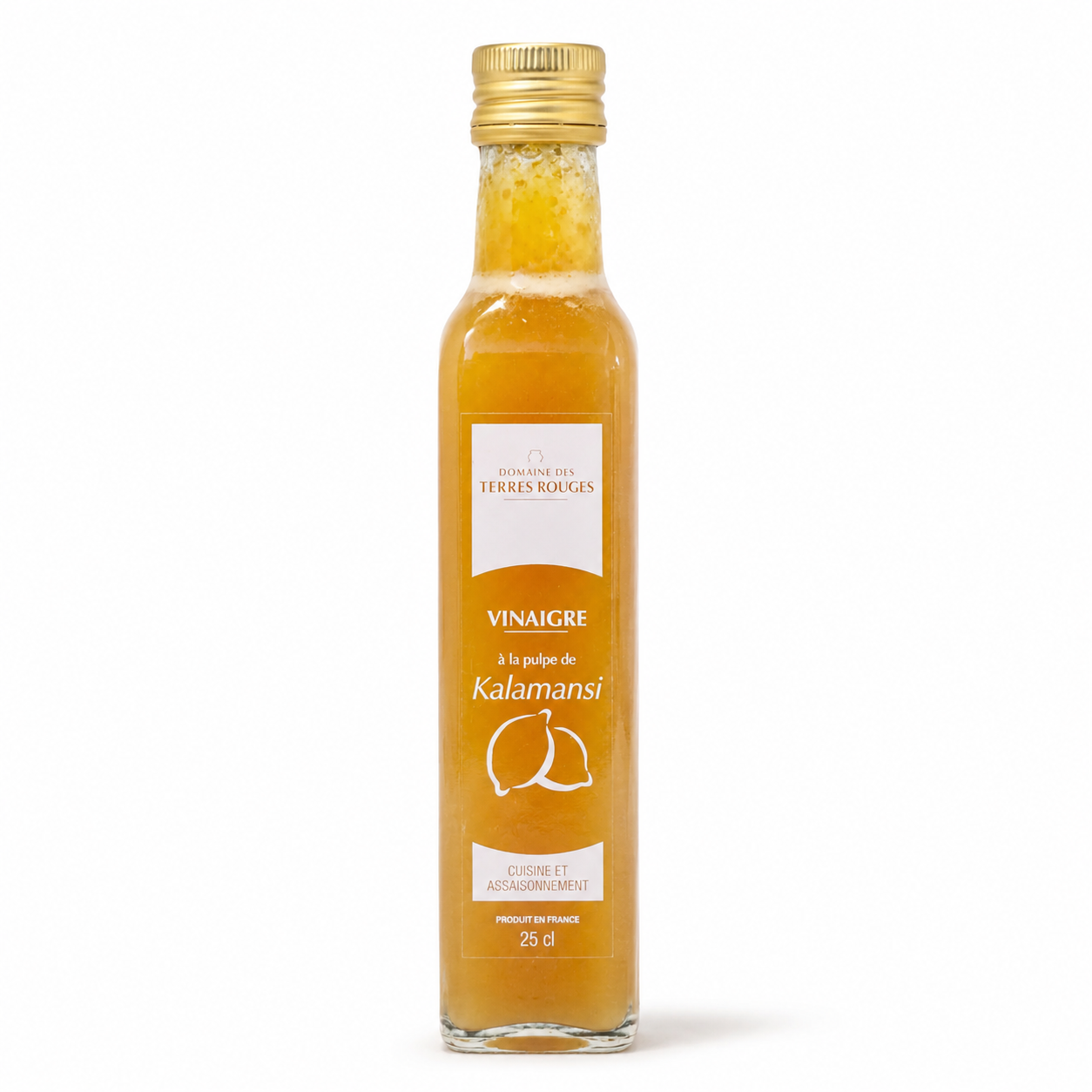 Bottle of Kalamansi vinegar with a gold cap on a white background