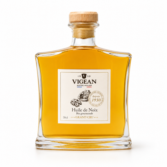 Bottle of Vigean walnut oil with a cork lid on a white background