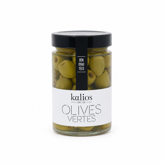 Jar of green olives with a black lid and white label on a white background