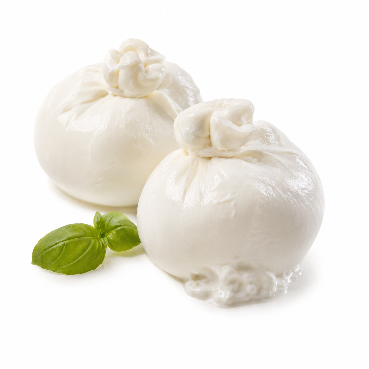 Two balls of mozzarella cheese with basil leaves on a white background