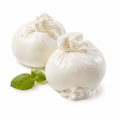 Two balls of mozzarella cheese with basil leaves on a white background