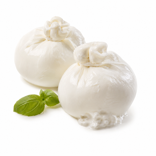 Two balls of mozzarella cheese with basil leaves on a white background